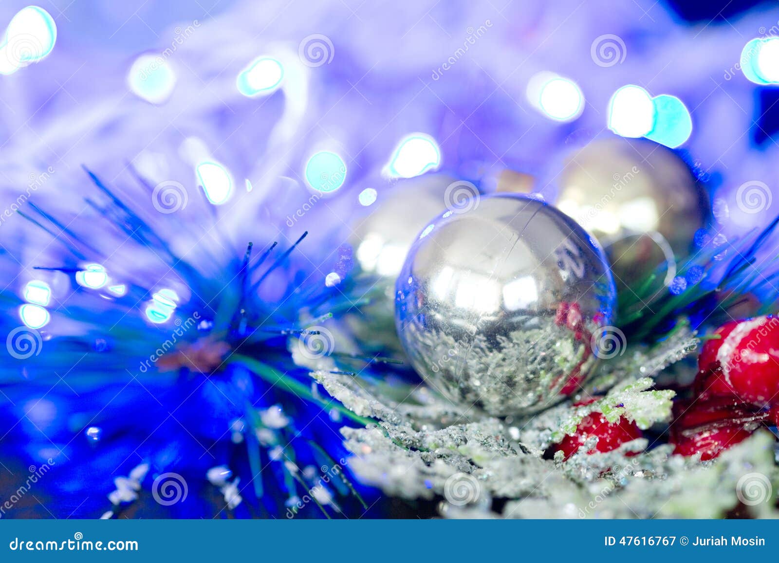 Christmas Silver Baubles and Ornaments Against Festive Lights Stock ...