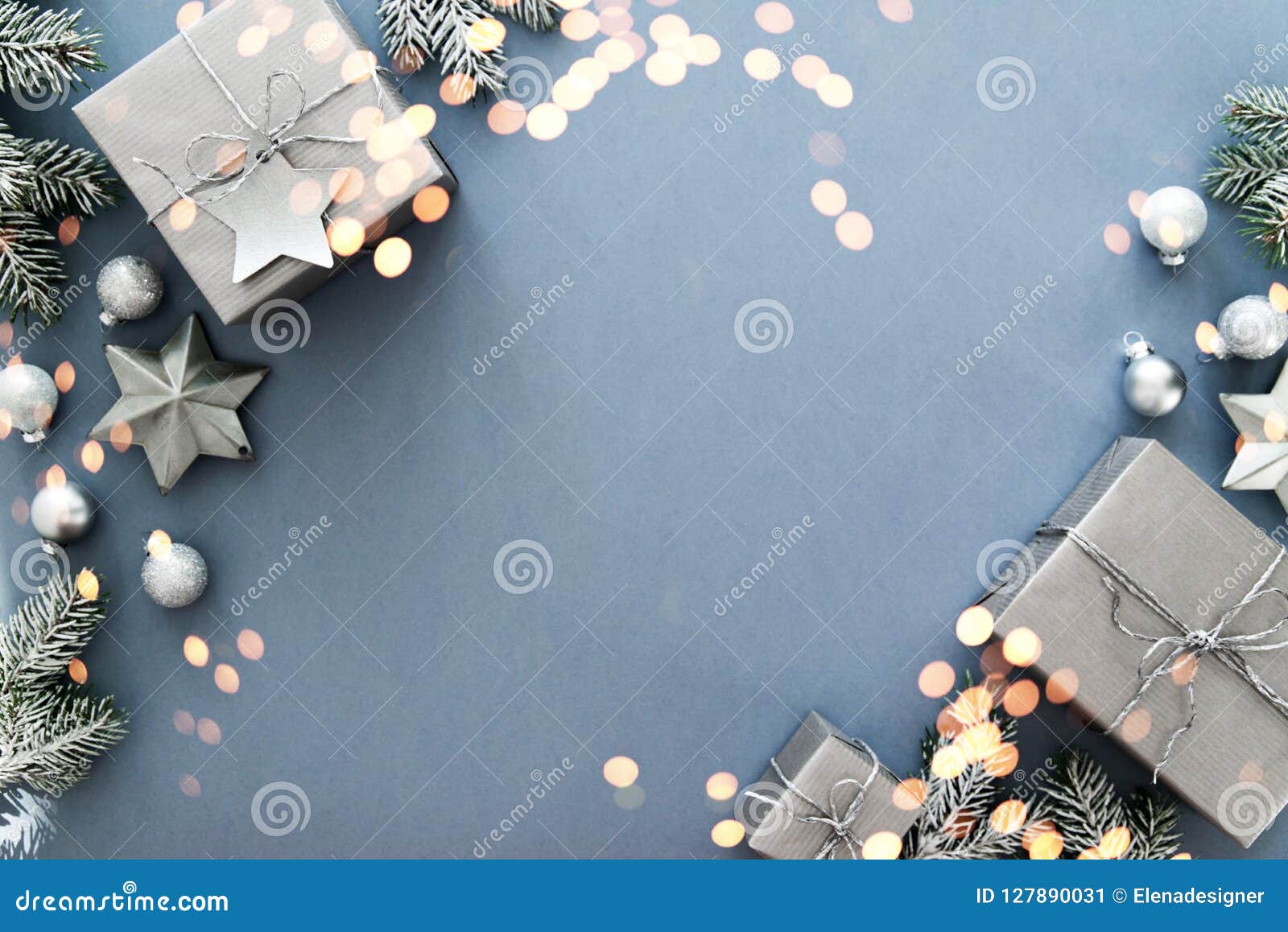 christmas silver handmade gift boxes on blue background top view. merry christmas greeting card, frame. winter xmas holiday theme.