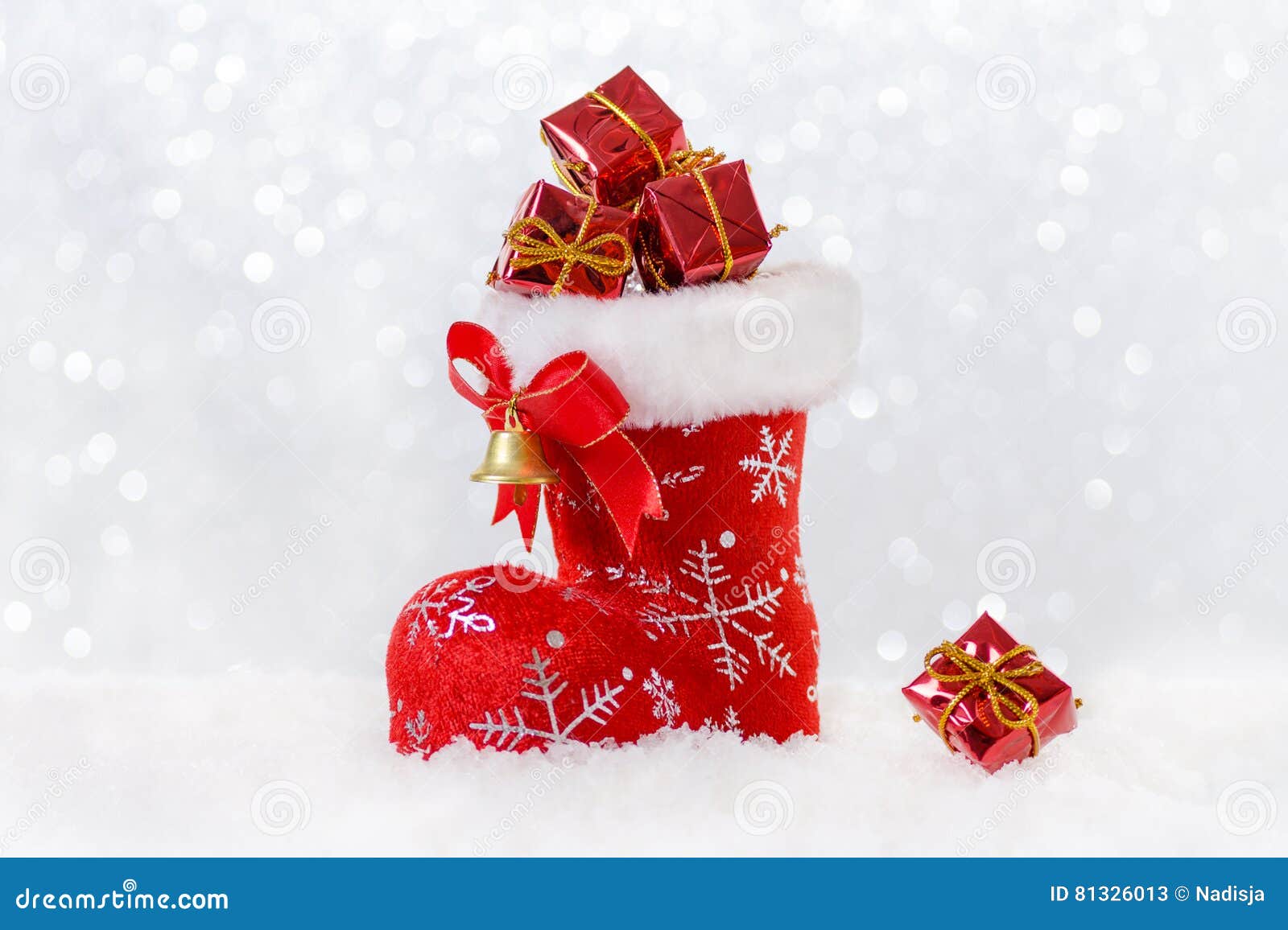 Christmas Stocking with Gifts, Santa`s Boot in Snow, Bokeh and ...