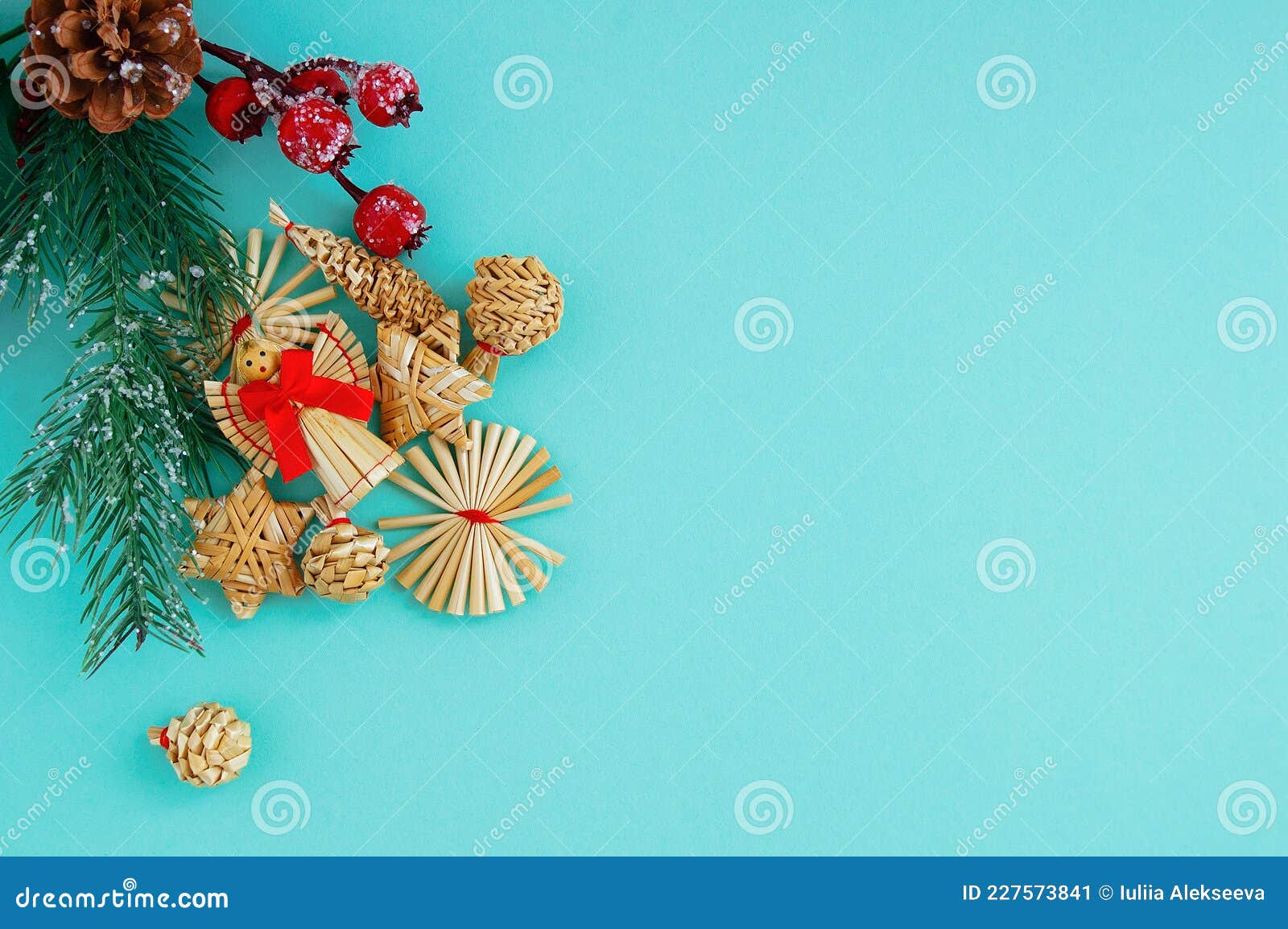 https://thumbs.dreamstime.com/z/christmas-straw-angel-red-bow-decorations-branch-tree-turquoise-background-227573841.jpg
