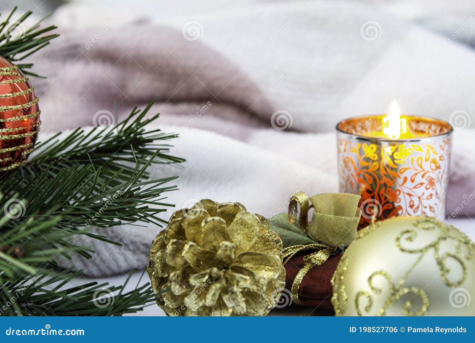 Christmas Theme Still Life with Candle and Blanket Stock Photo Image