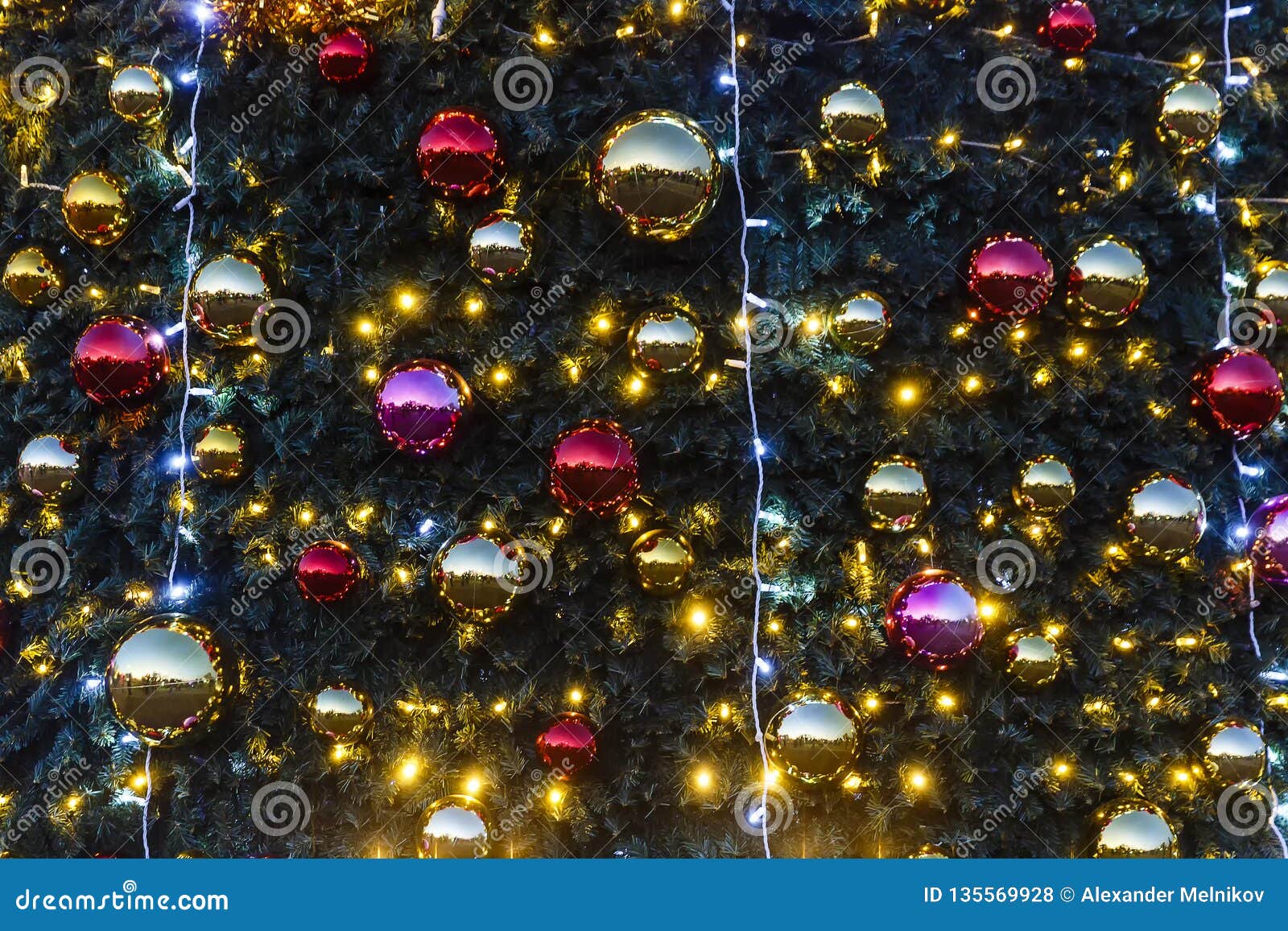 Christmas Toys and Garlands Hanging on the Christmas Tree Stock Photo ...