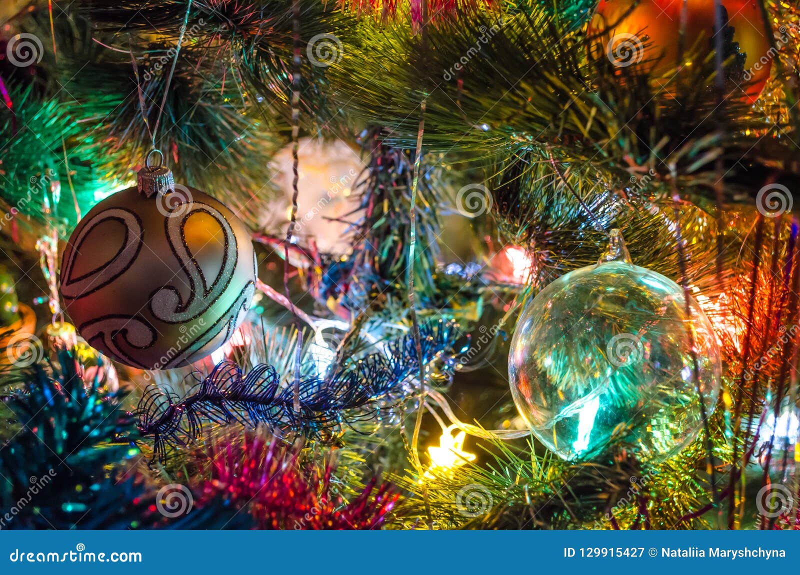 Christmas Toys on Christmas Tree with Luminous Festoon Closeup. New ...