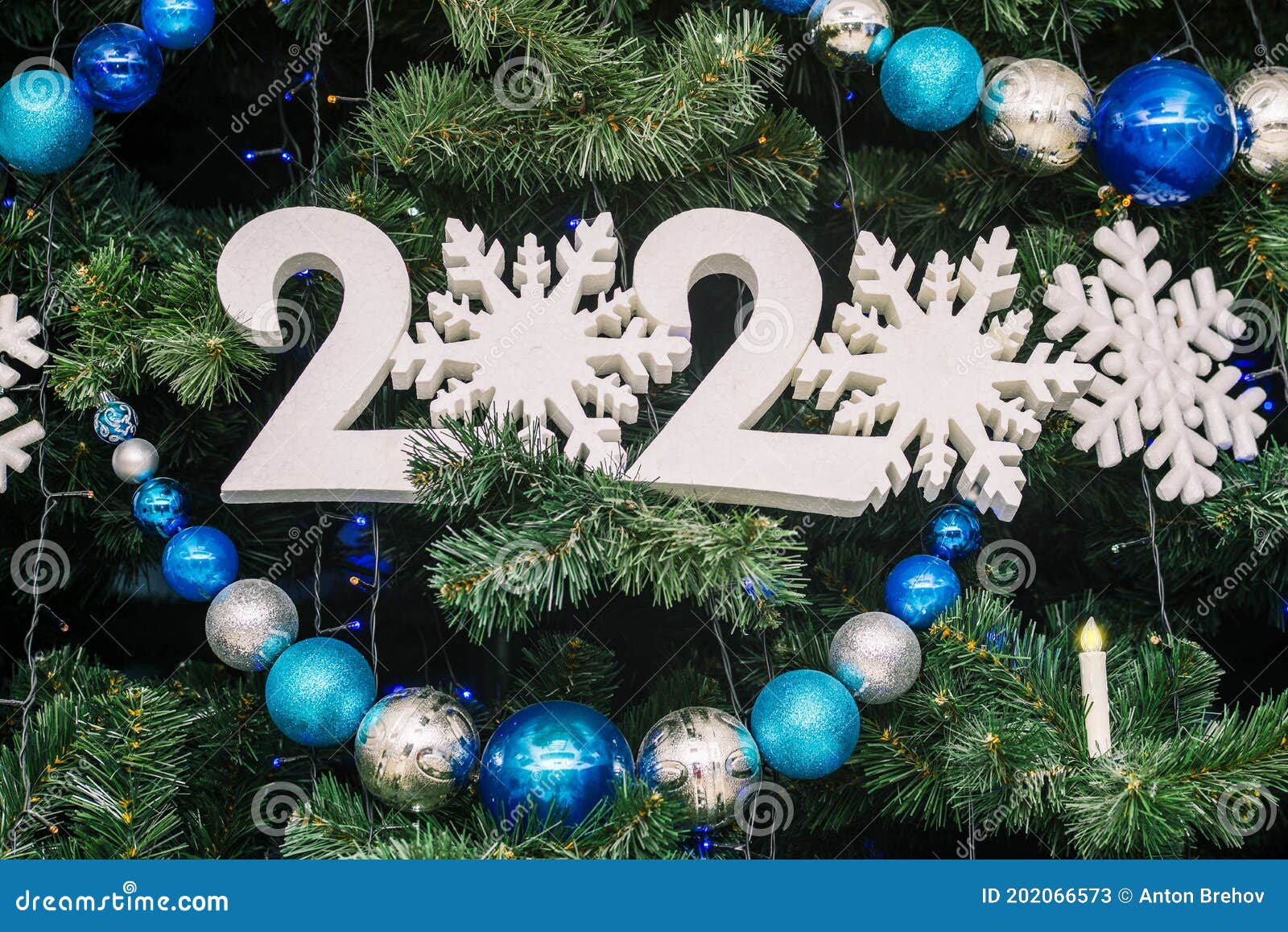 Christmas Tree with Big Christmas Balls, Garland and Sign 2021 Stock