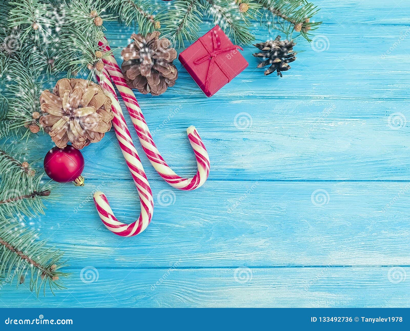 Christmas Tree Branch, Candy on a Blue Wooden Background Stock Photo ...