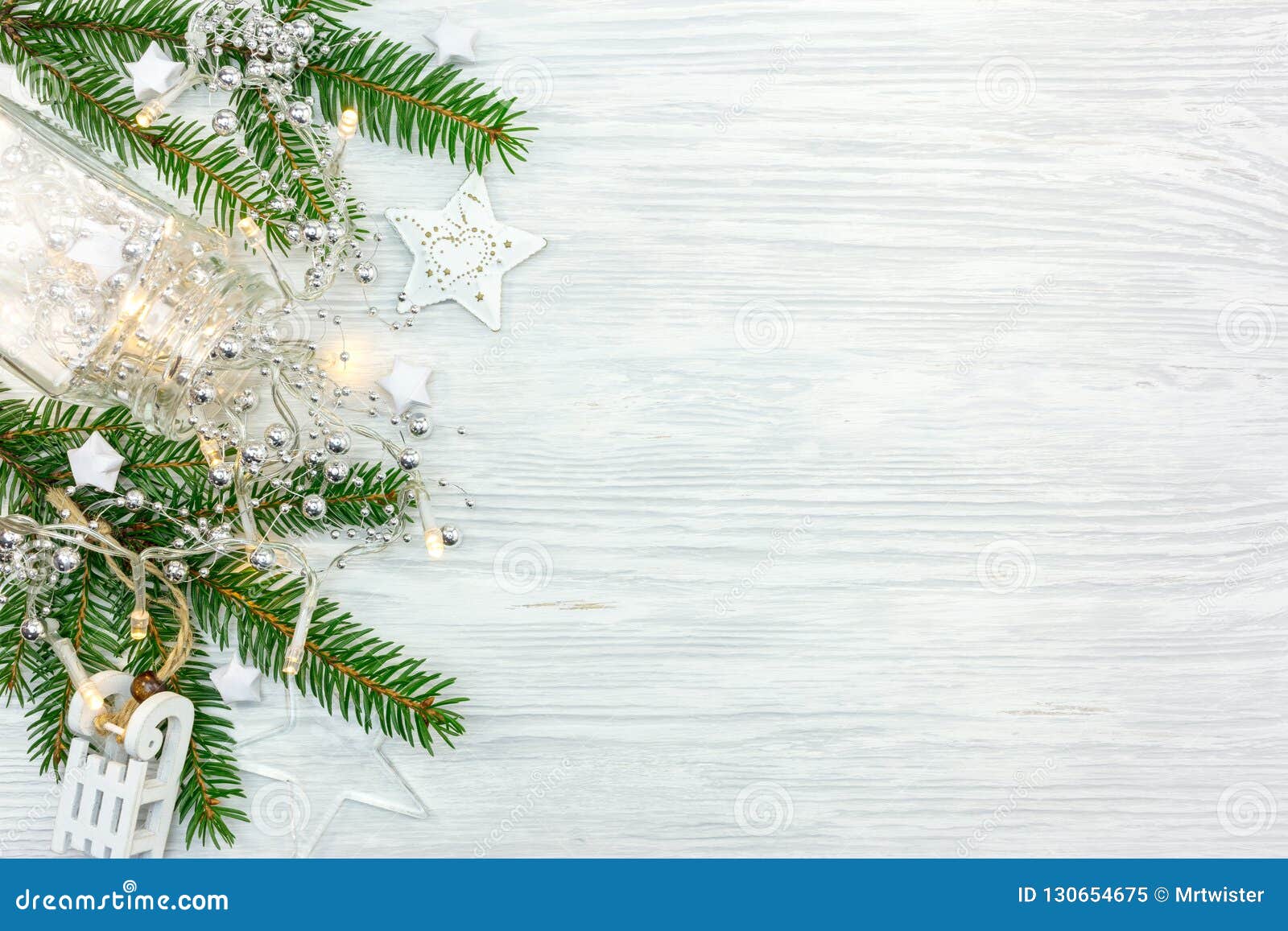 Christmas Tree Branch Decorated with Garland Lights and Differen Stock