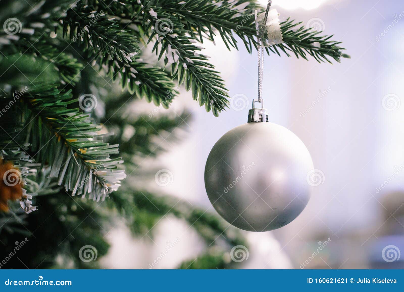 Christmas Tree Branch Decorated with Silver Balls and White Decor Stock