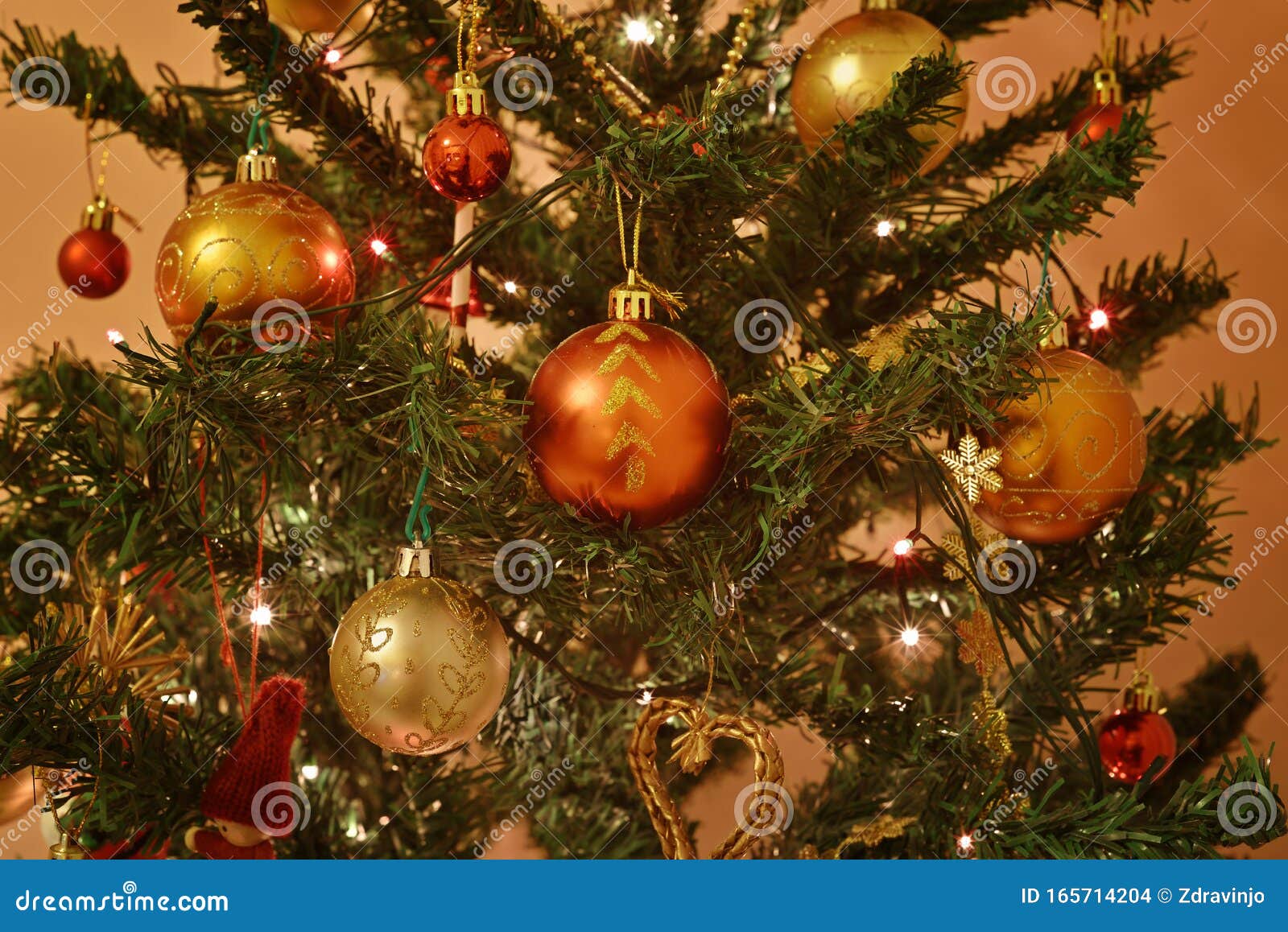 Christmas Tree Decorated with Ornaments and Blinking Light Bulbs Stock ...