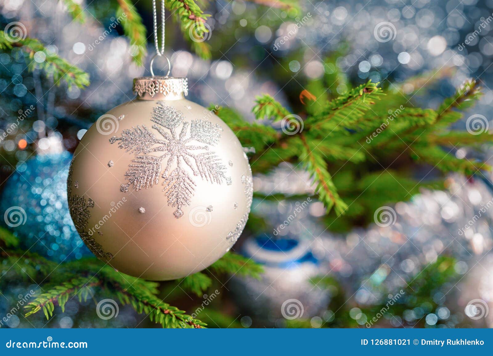 christmas-tree decoration bauble on decorated christmas tree bac