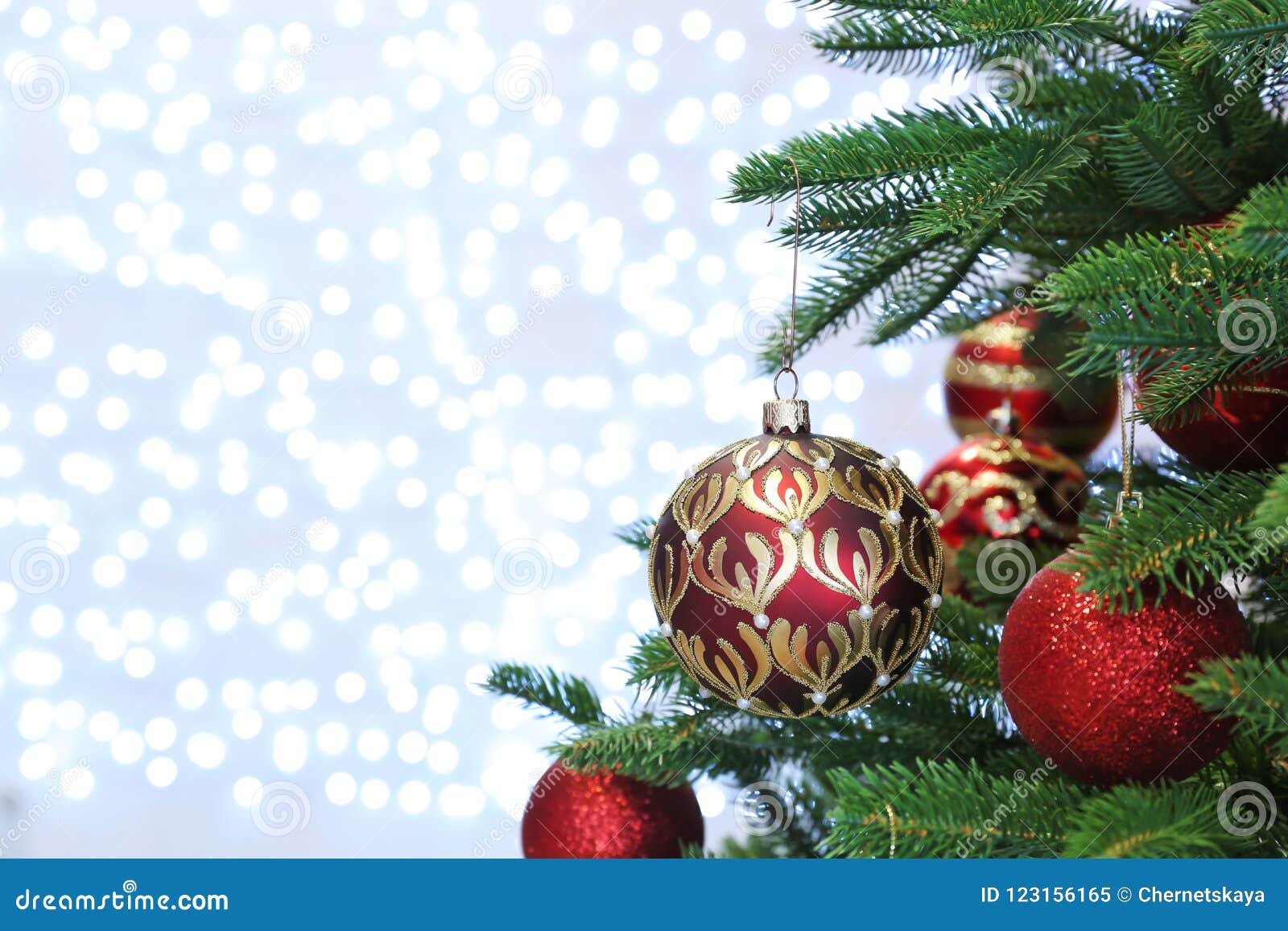 Christmas Tree with Festive Decor Against Fairy Lights Stock Image ...