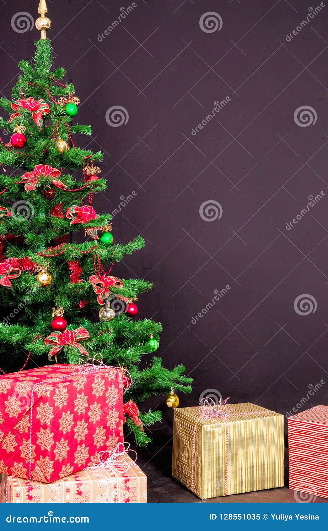 Christmas Tree with Christmas Gifts on Black Background Stock Image