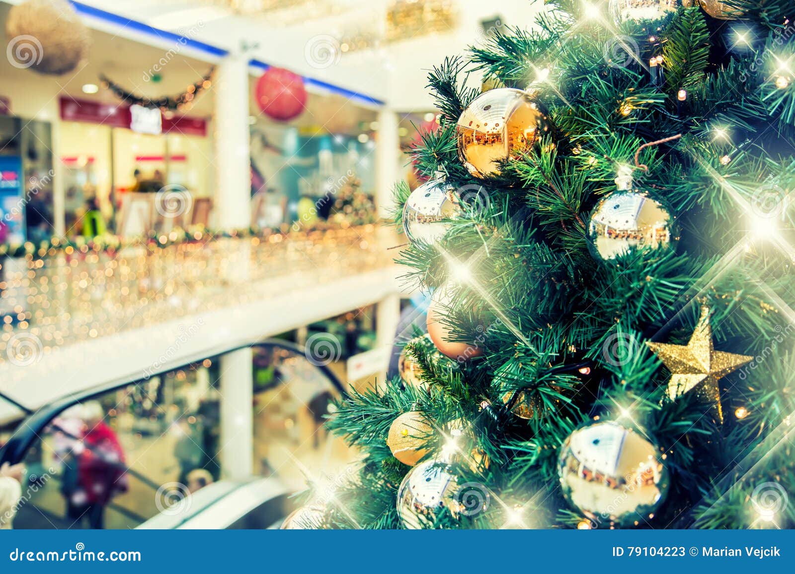 Christmas Tree with Gold Decoration in Shopping Mall. Stock Image