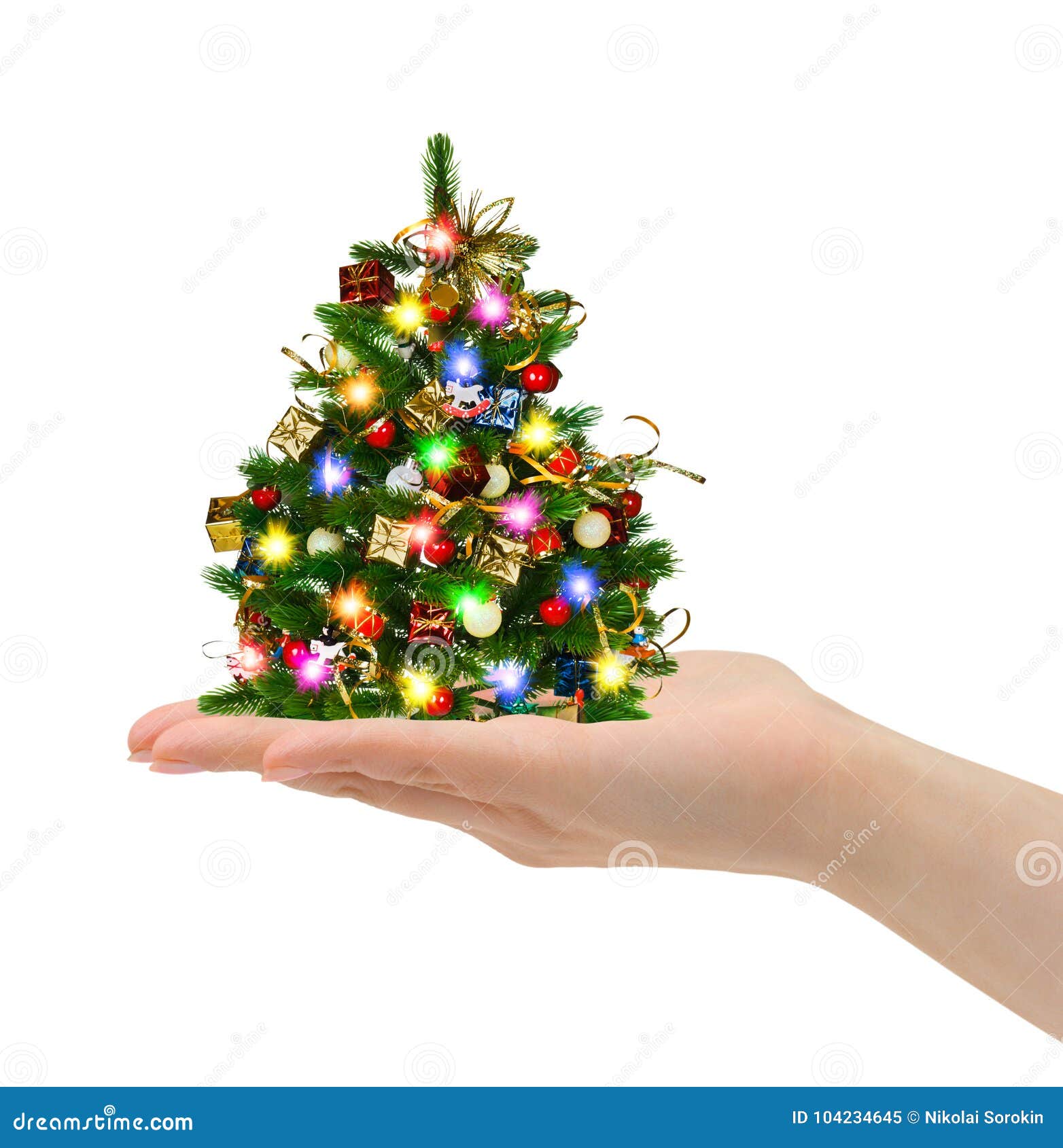 Christmas tree in hand stock image. Image of lights 104234645