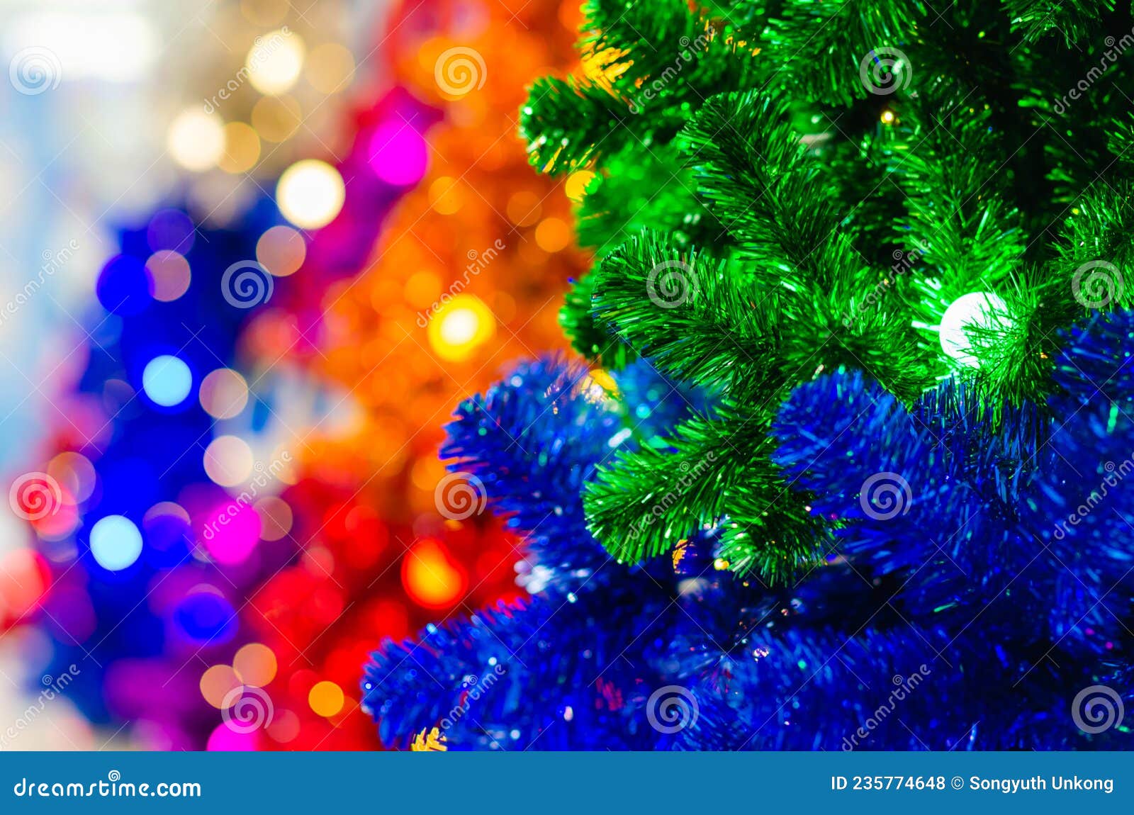 Christmas Tree with Light Bulb and Blurred Focus of Colorful Christmas