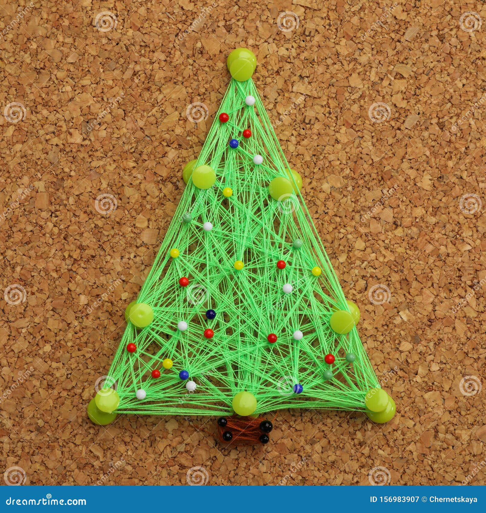 Christmas Tree Made of Thread and Pins on Cork Board Stock Image
