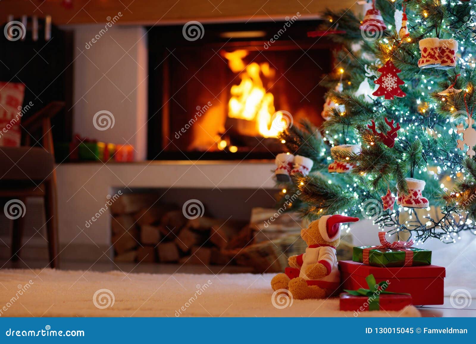 Christmas Tree with Presents at Fire Place. Stock Image - Image of ...