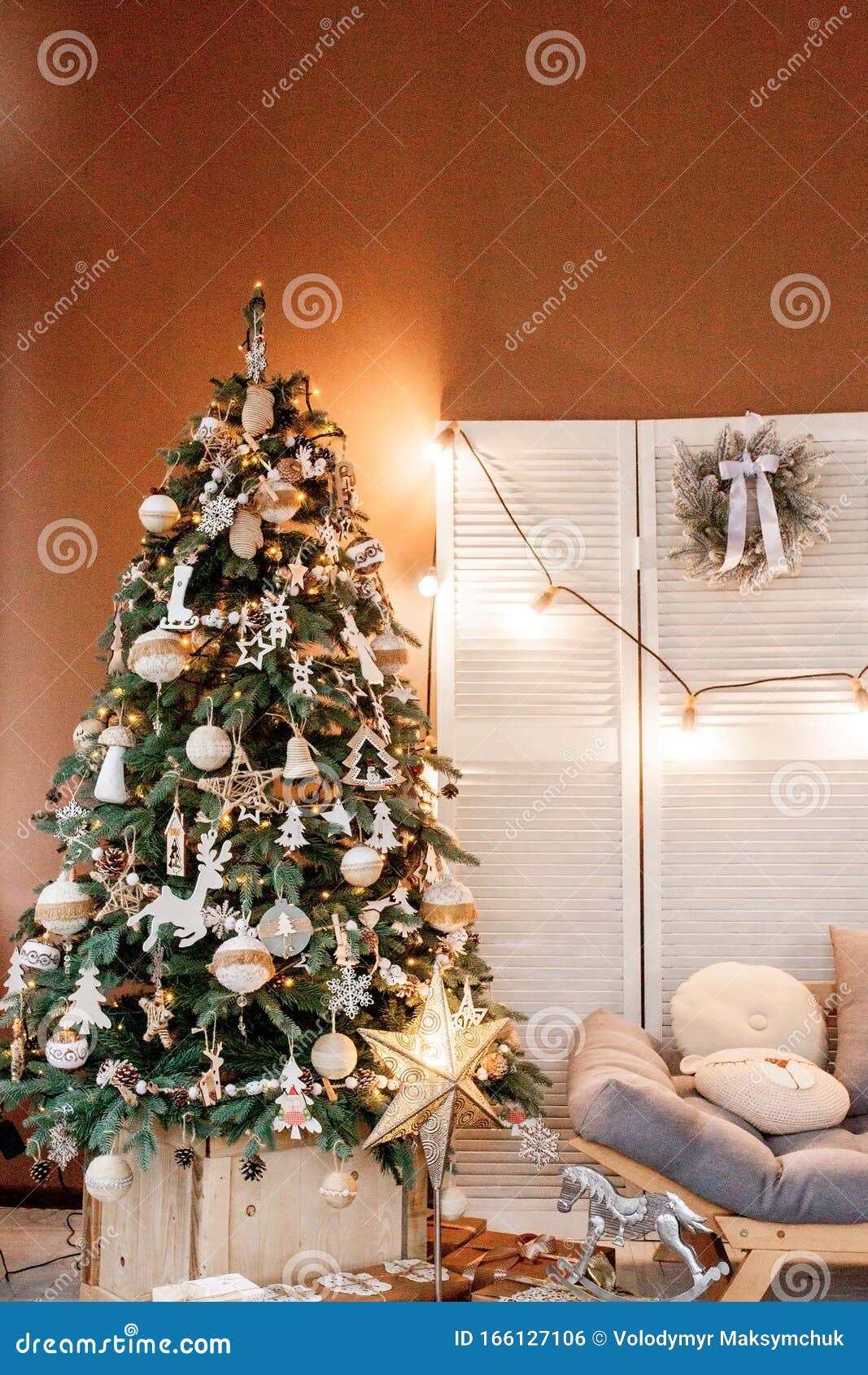 Christmas Tree with Presents Underneath in Living Room Stock Photo