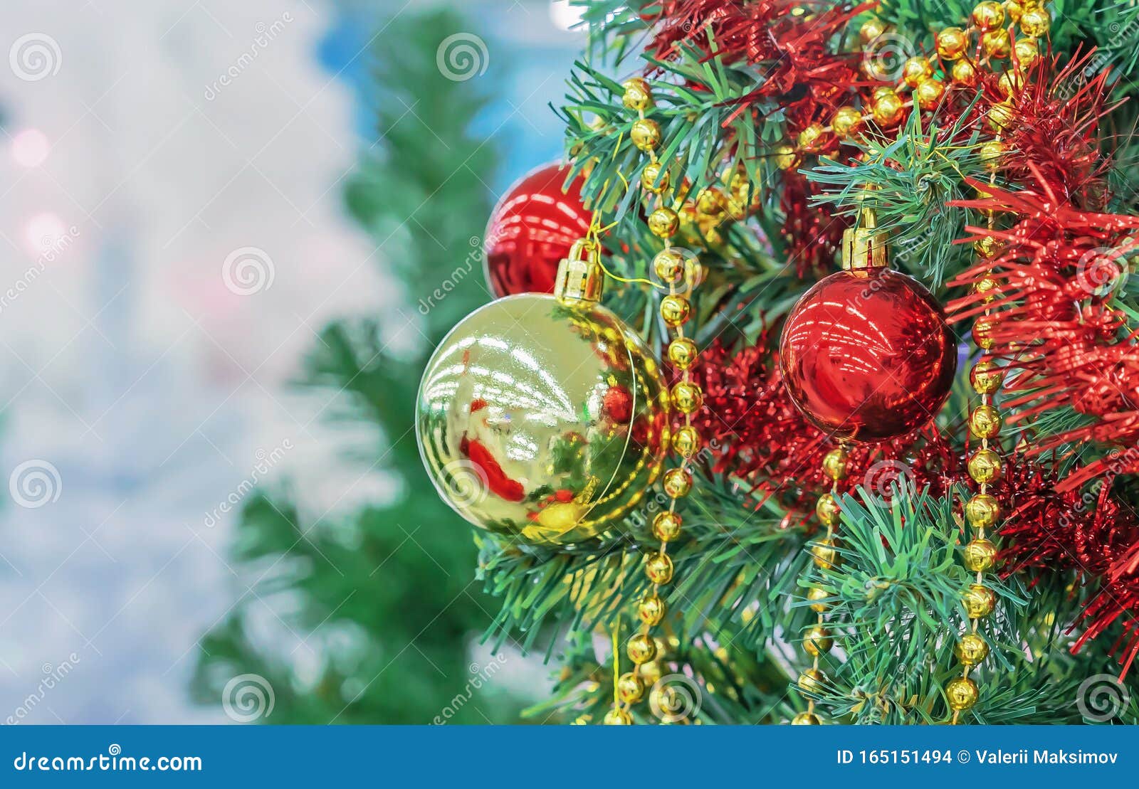 Christmas Tree with Red and Yellow Christmas Balls, Beads and Tinsel ...