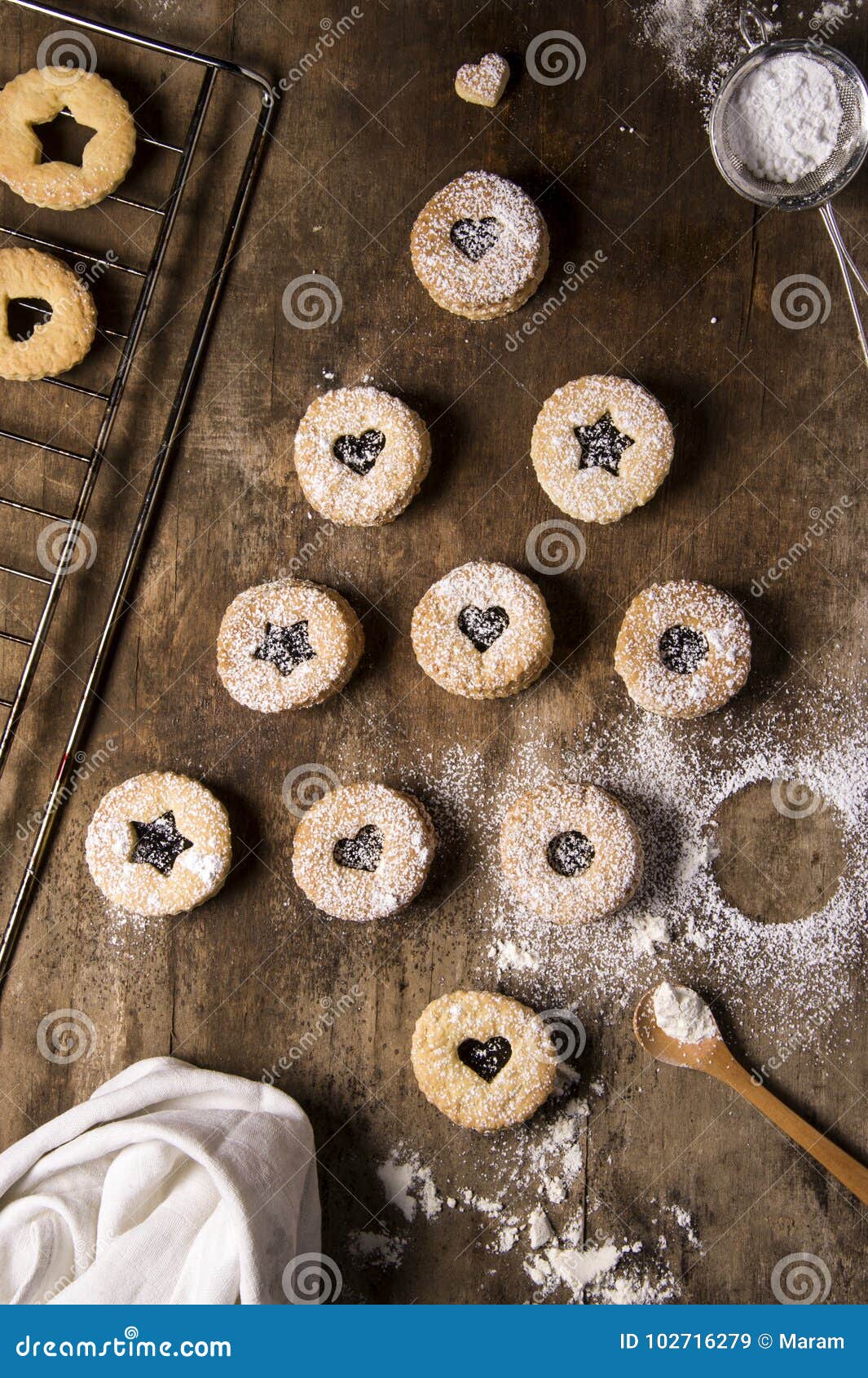 christmas tree  from cute rustic cakes on brown wooden background. holiday concept.