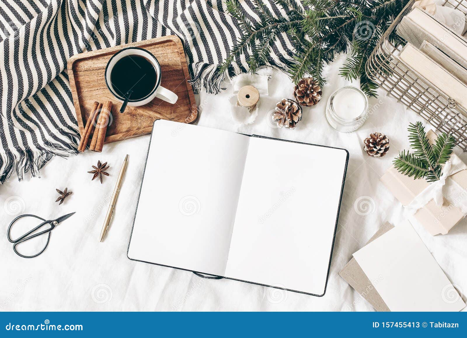 christmas, winter composition. blank greeting card, open diary, sketch book mock-up scene. cup of coffee, old book, pine