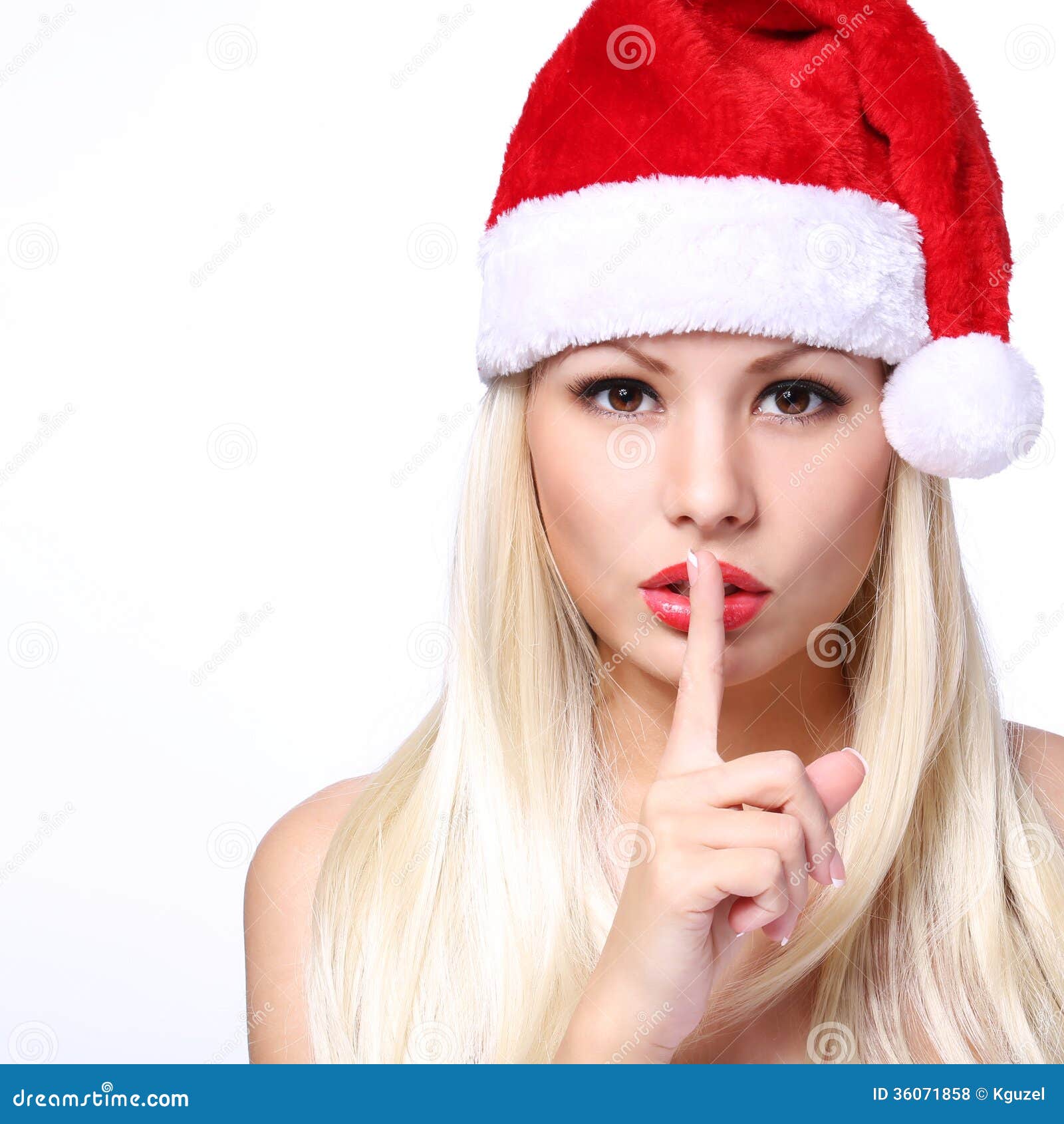 christmas woman. blonde girl in santa hat showing hush