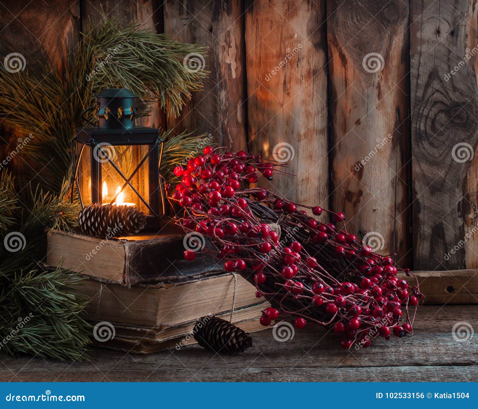 Christmas Wreath with Berries on Old Books with a Lantern on Wooden ...