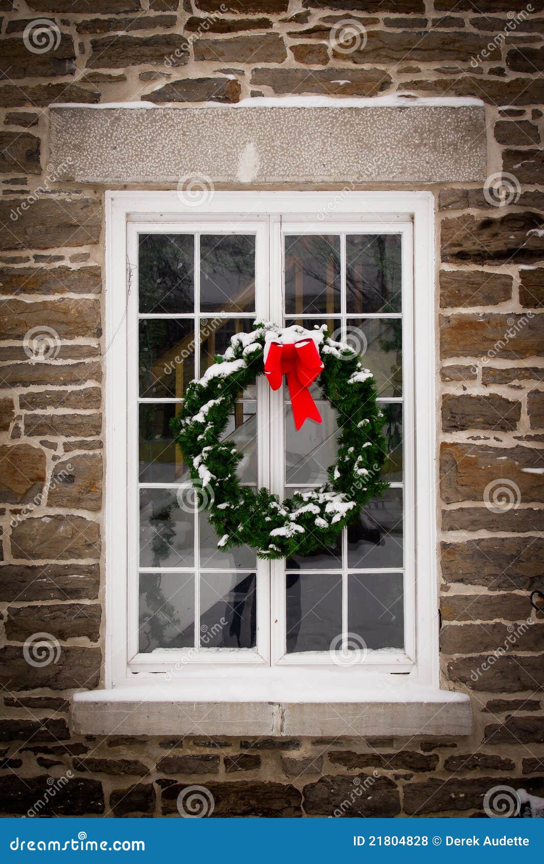 christmas wreath on old window pane