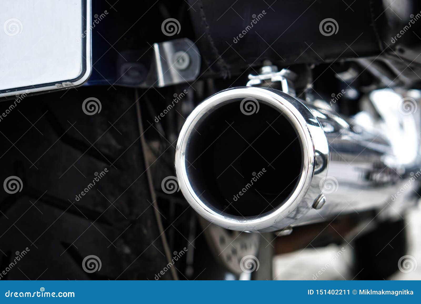 Chrome Biker Motorcycle Exhaust Pipe. Problems of Ecology and Air