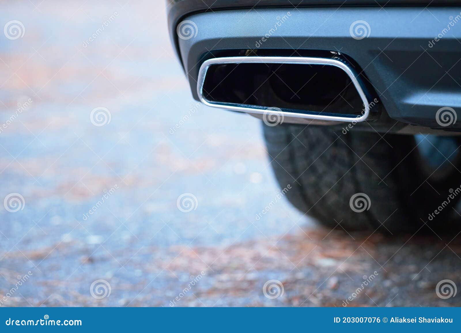 chrome exhaust pipe selective focus of powerful luxury car with black bodywork as part of exhaust system car muffler of