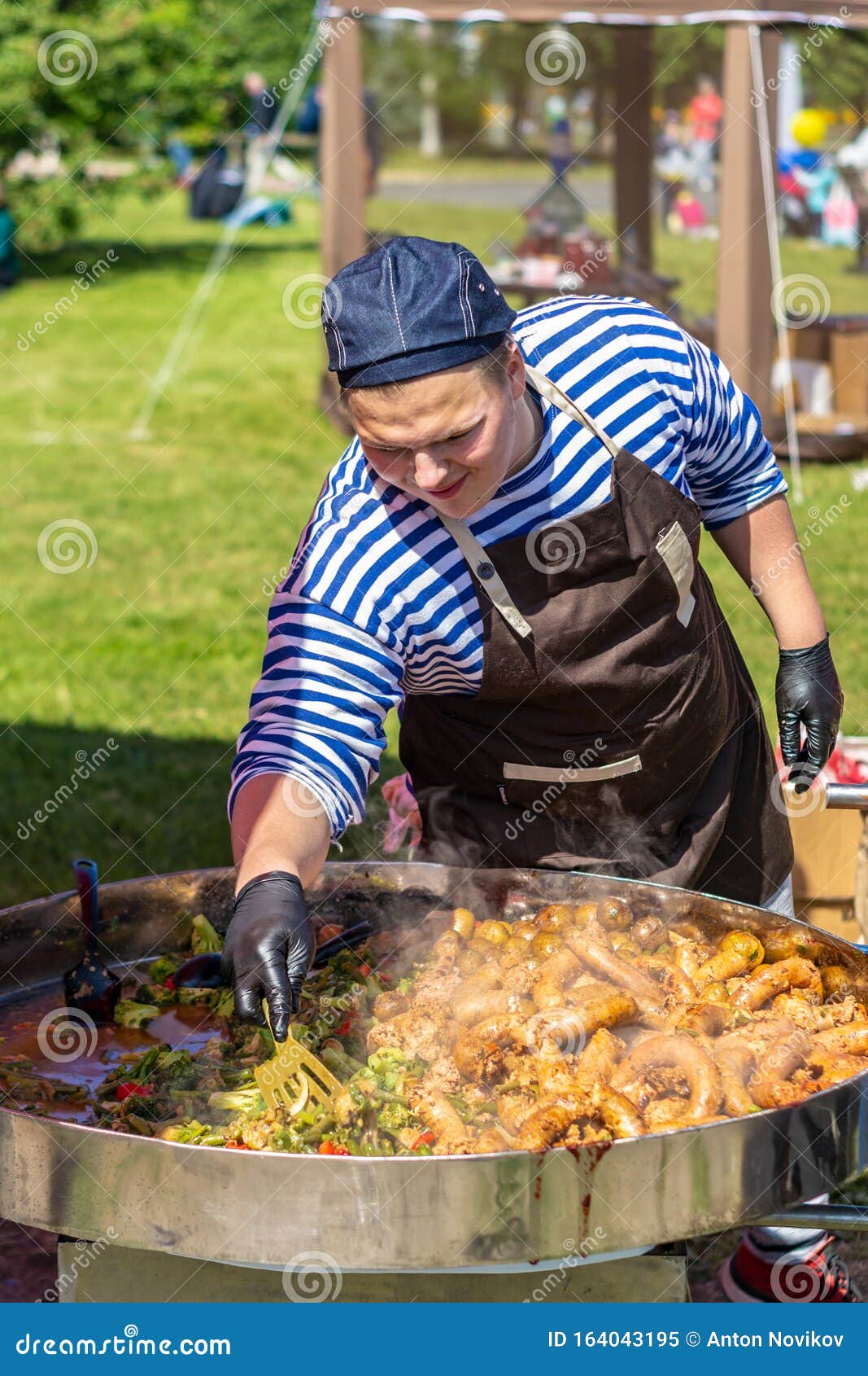 Chubby Cook Prepares Food in a Huge Street Grill Editorial Image