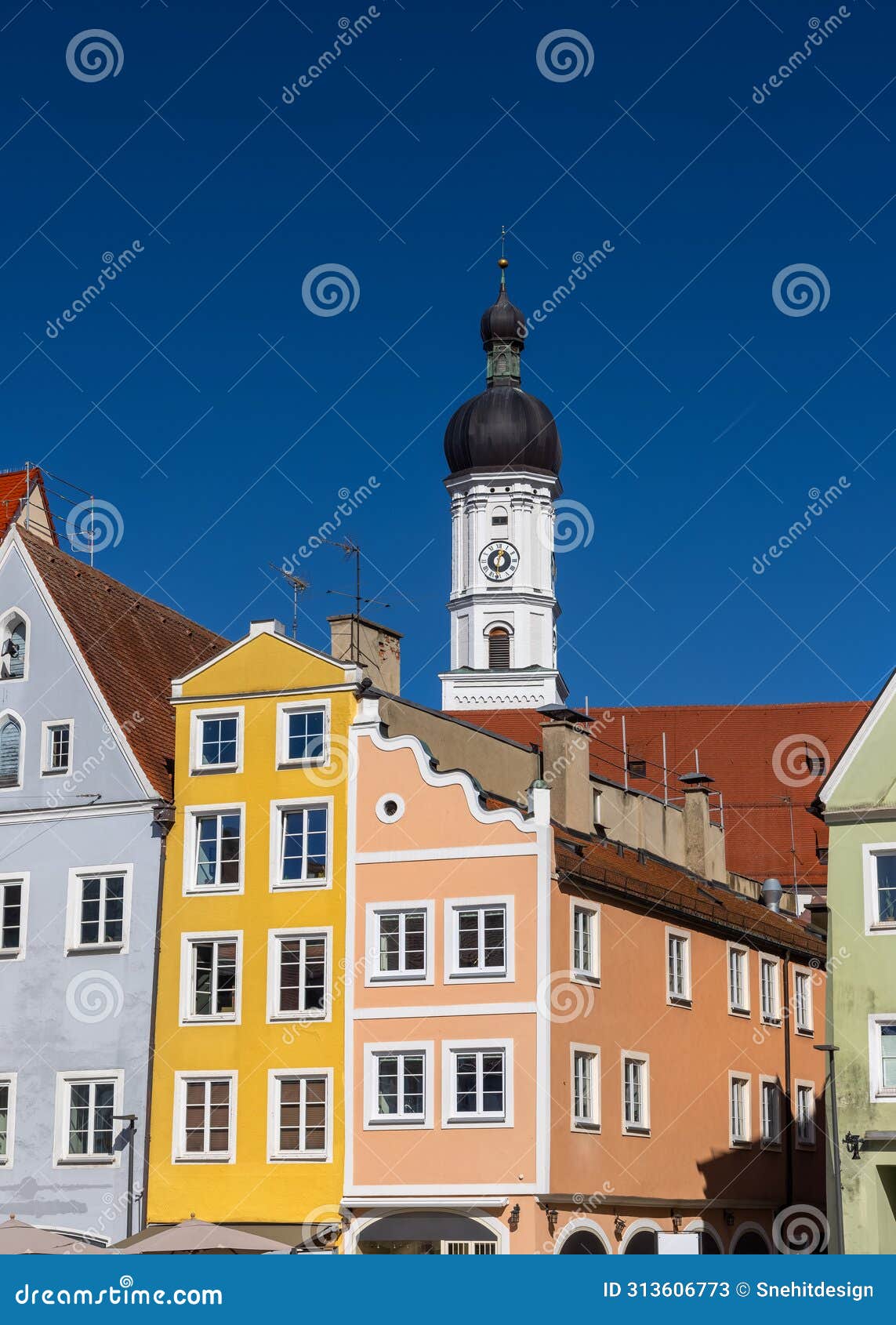 church of the assumption of mary and colorful buildings in landsberg city germany