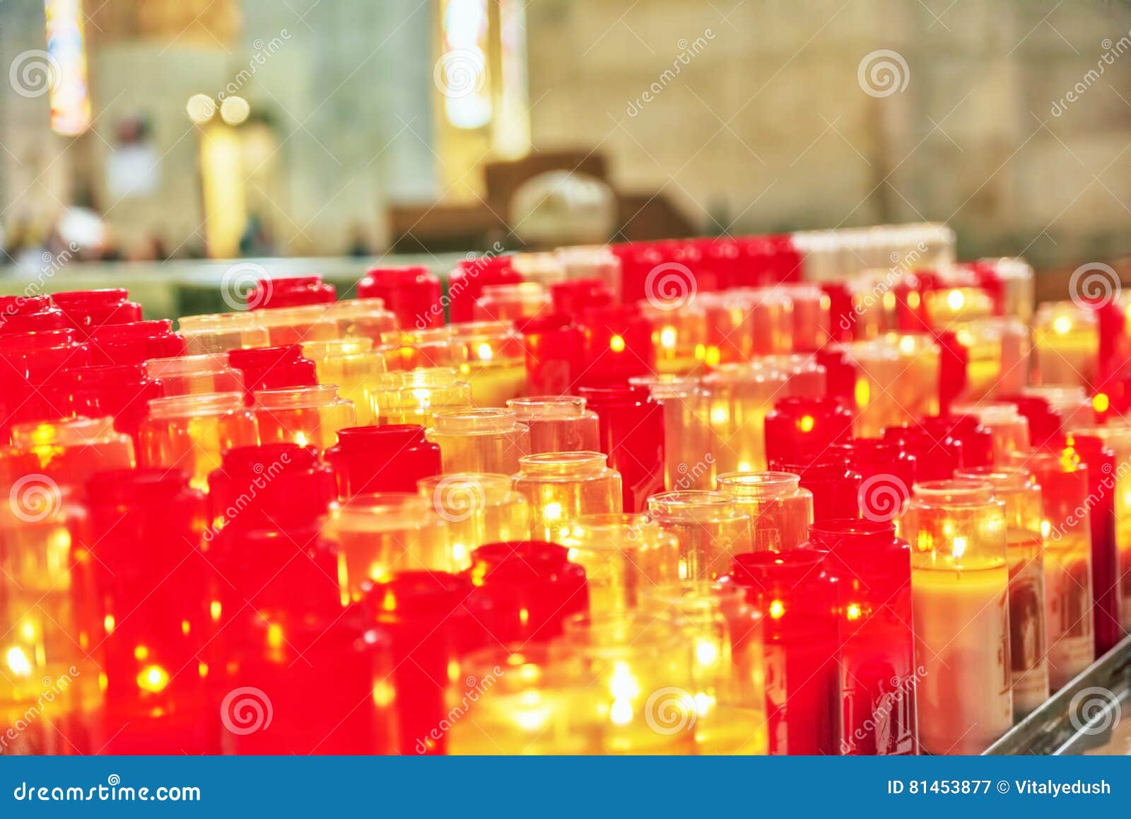 Church Burning Candles in Glass Candlesticks in the Cathedral. Stock