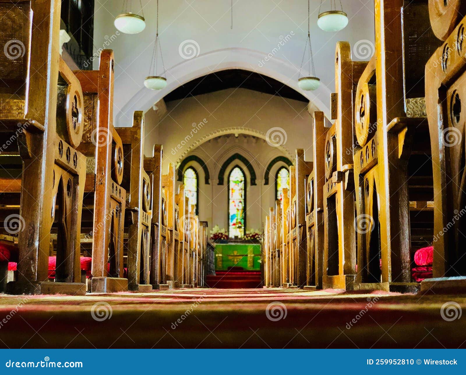 Church Interior with a Long Rug, Benches and the Nave Stock Photo