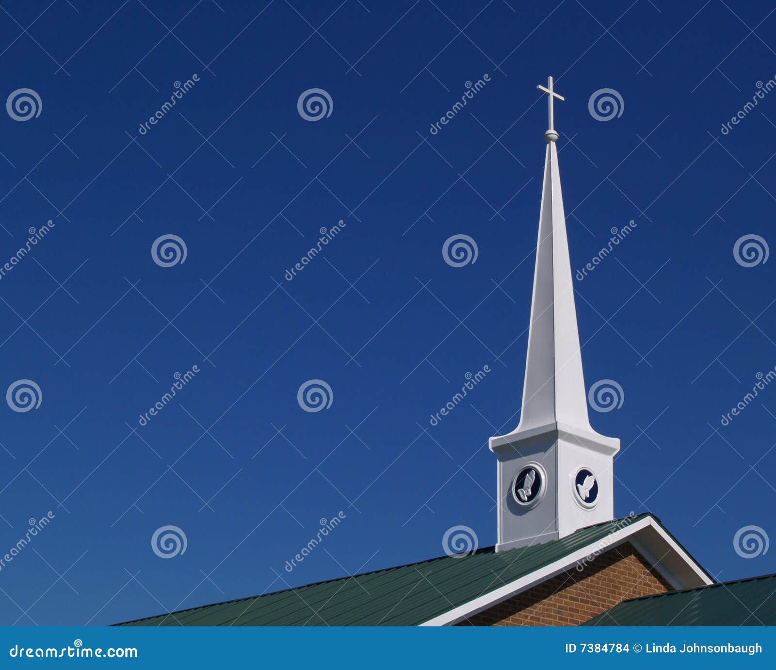 Church steeple with praying hands and space for copy.