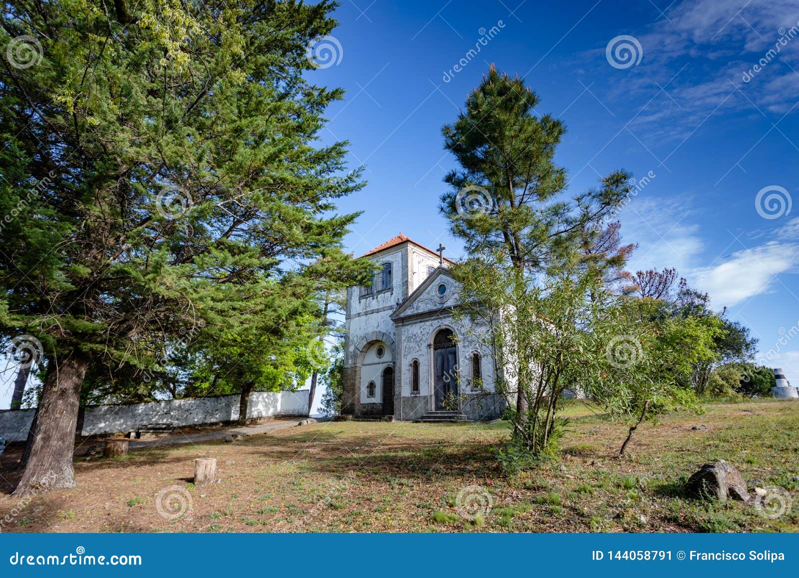 church among  trees at summer time, in figueiro dos vinhos, portugal
