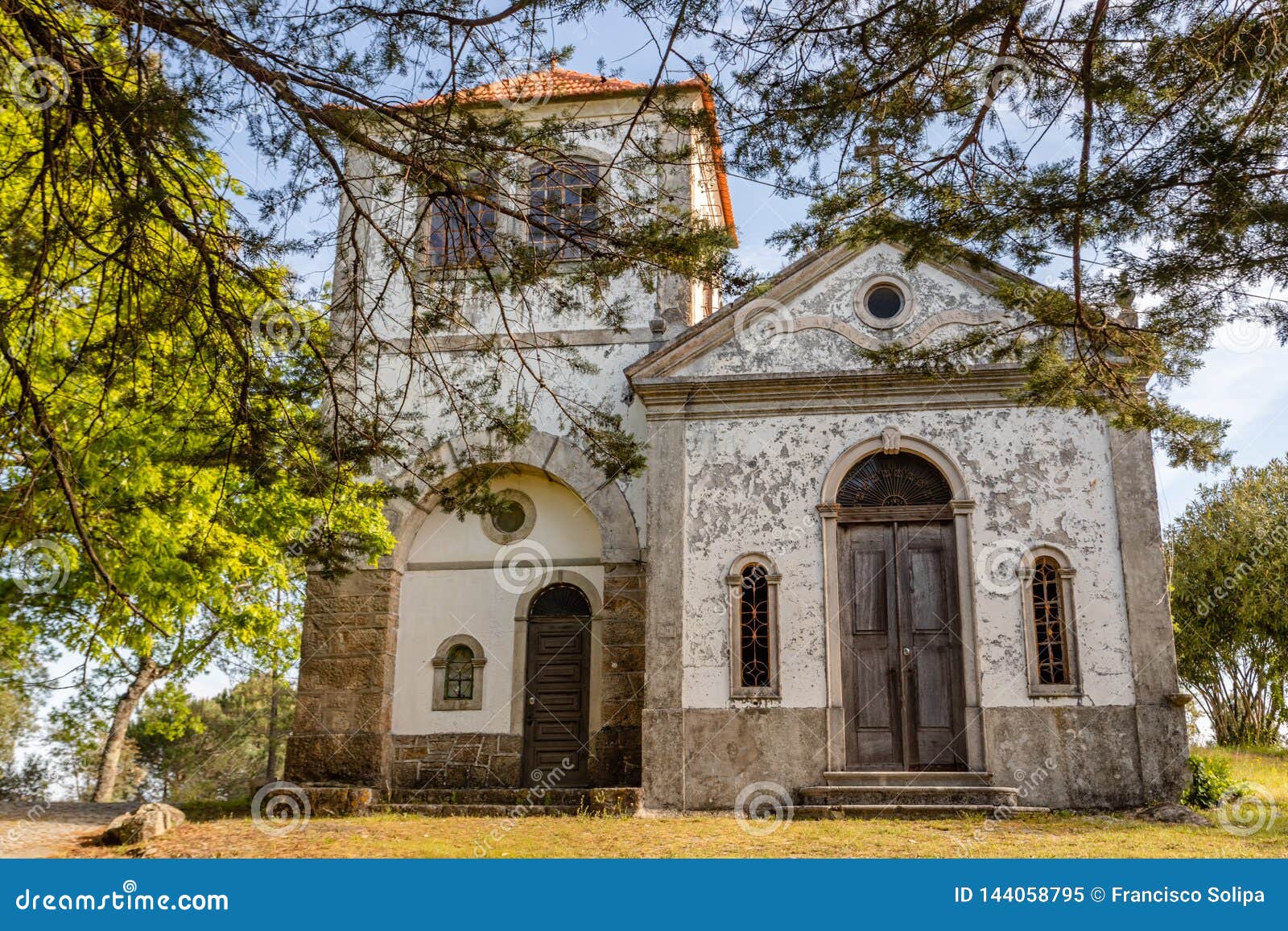 church among  trees at summer time, in figueiro dos vinhos, portugal