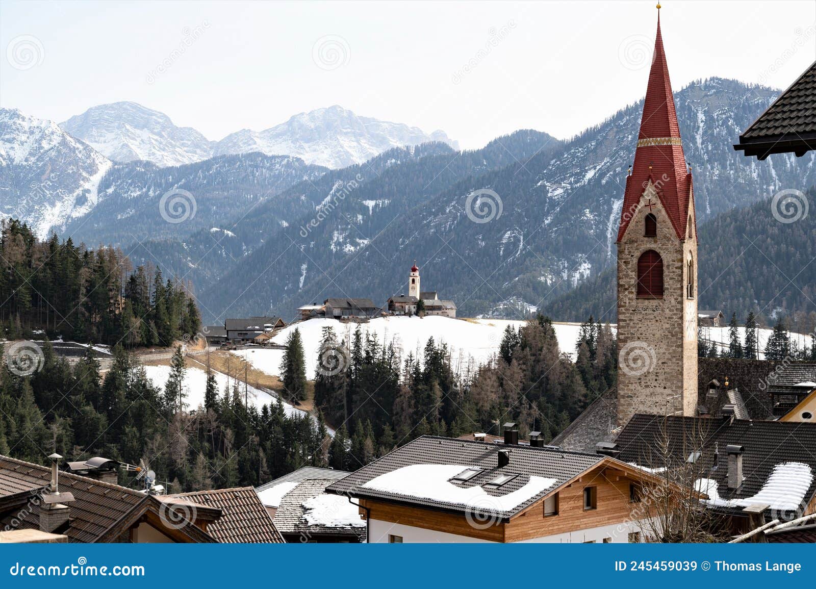 the churches of mareo in the dolomites, also known as enneberg pfarre and of  the hamlet costa