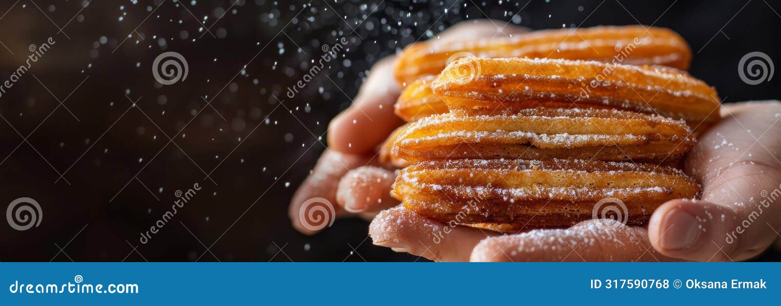 churro sticks in hand, churros pastry, fried spanish dessert, churro sticks closeup, copy space