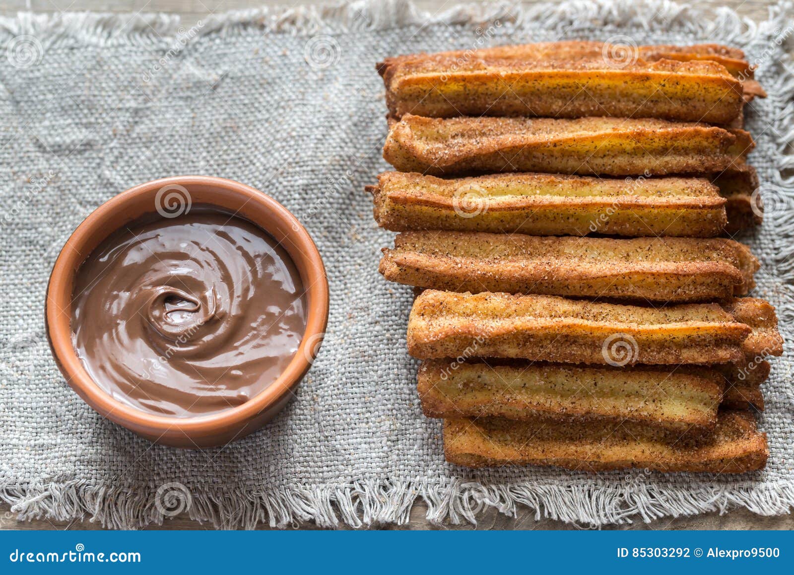 Churros Famous Spanish Dessert With Chocolate Sauce Stock Photo churros-famous-spanish-dessert-with-chocolate-sauce-stock-photo