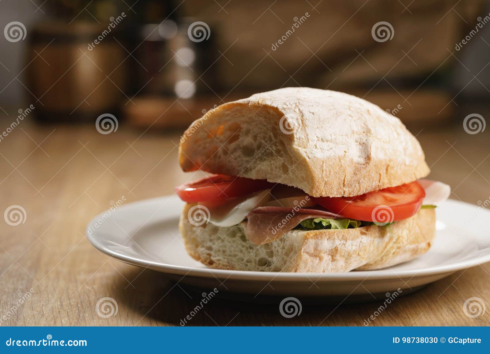 Ciabatta Sandwich with Speck, Mozzarella and Vegetables Stock Photo