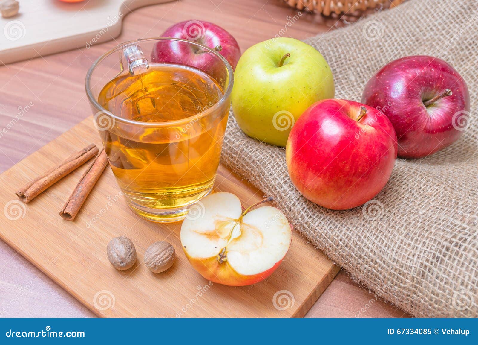 Cider Alcohol Hot Apple Drink and Apples on Wooden Table Stock Image