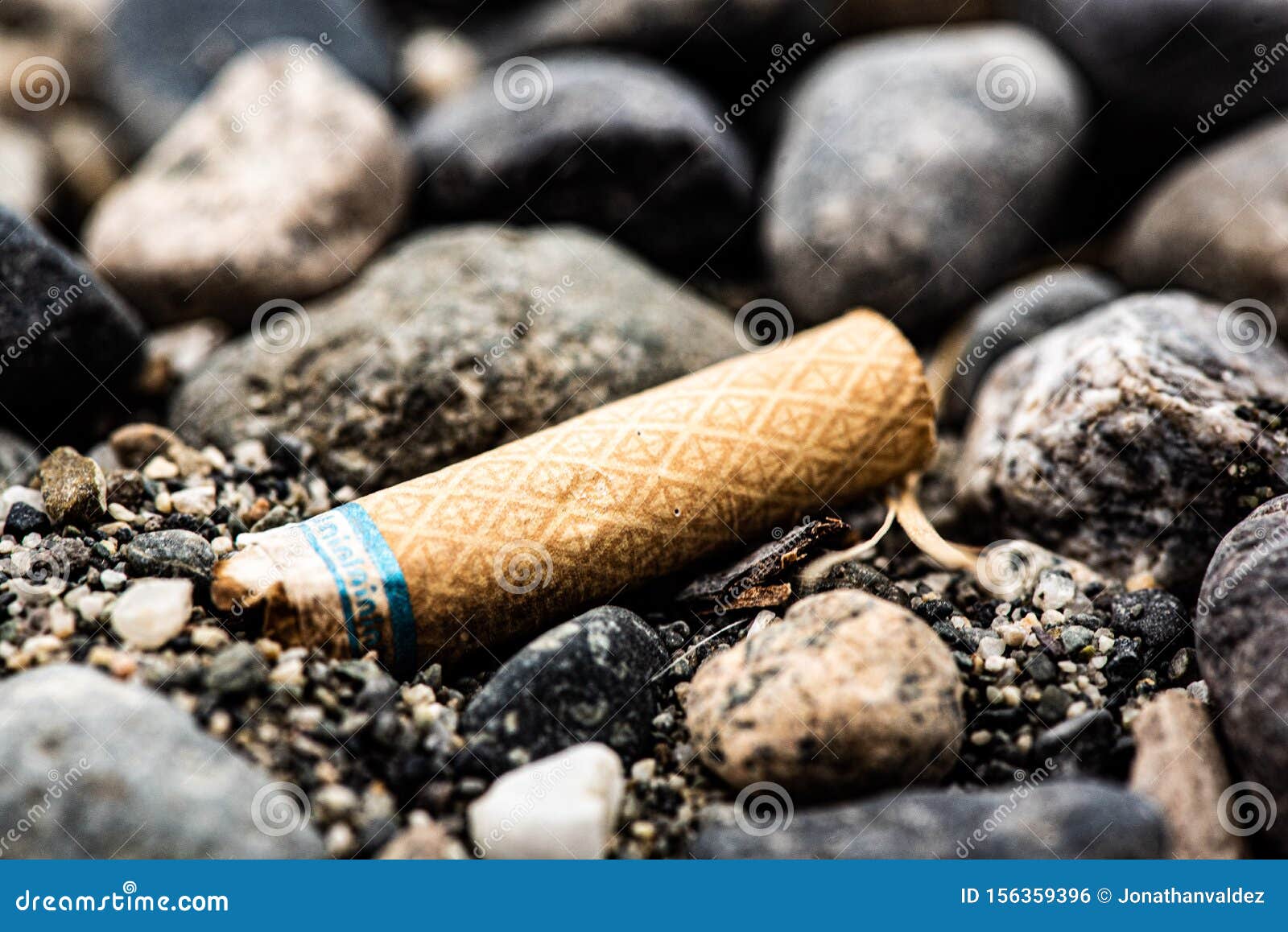 A Cigarette on the Beach stock photo. Image of seaside 156359396