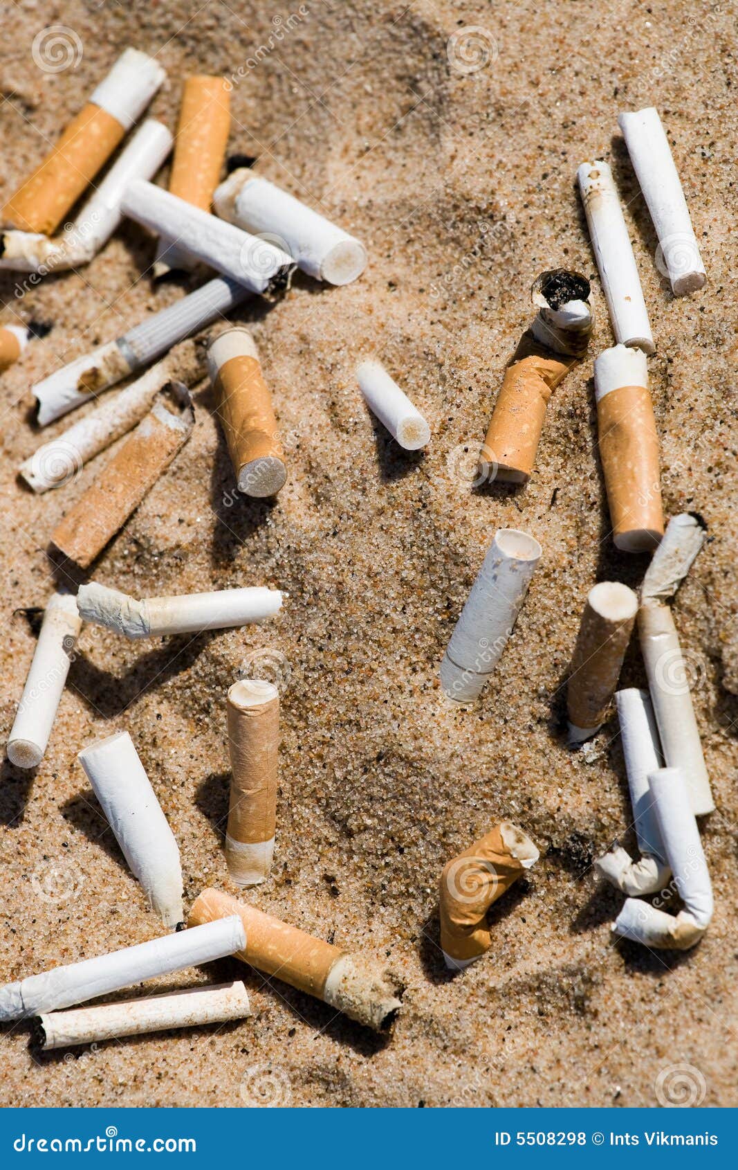Cigarette in sand stock photo. Image of beach, debris 5508298