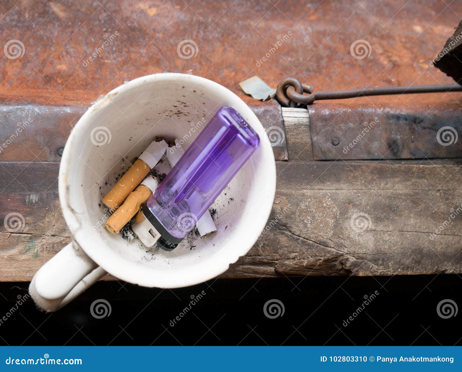 Cigarette Discard and Break To Coffee Cup with Lighter To Quitt Stock