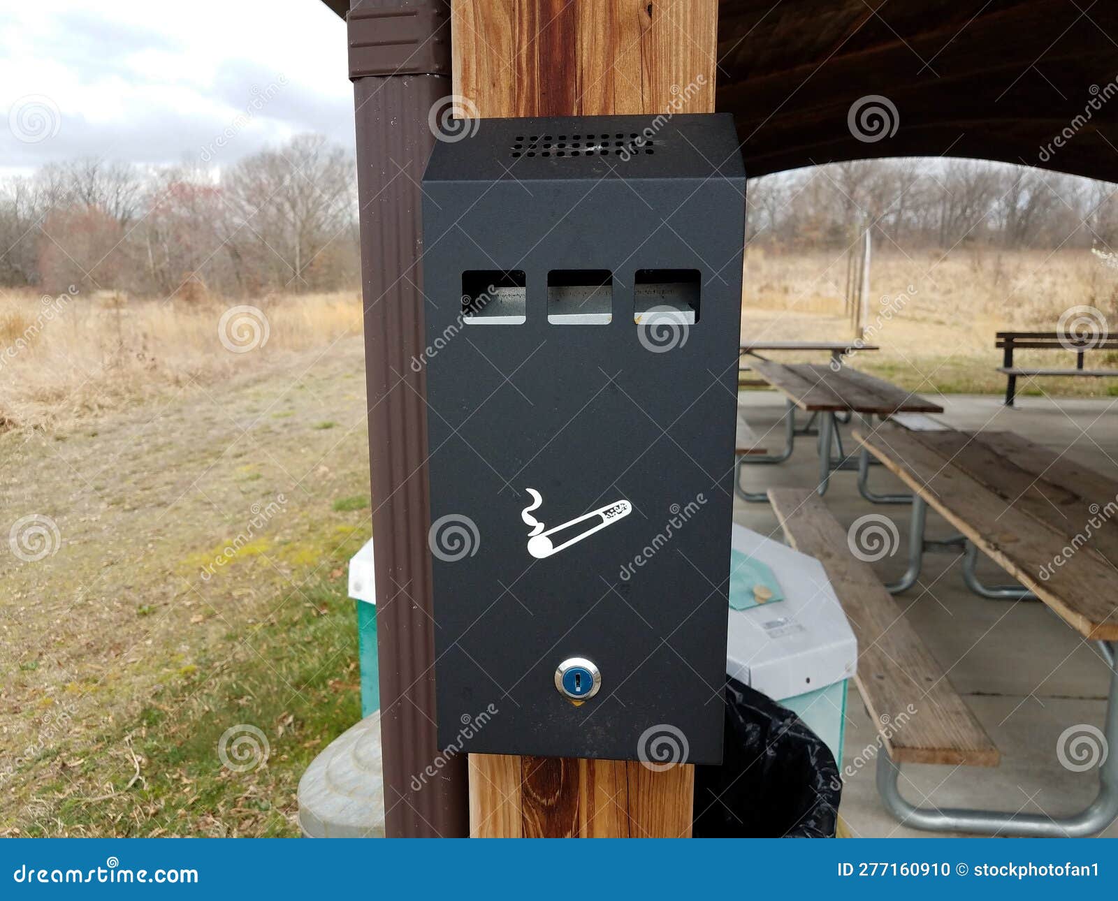 Cigarette Disposal Can or Trash Can on Post in Park Stock Photo Image