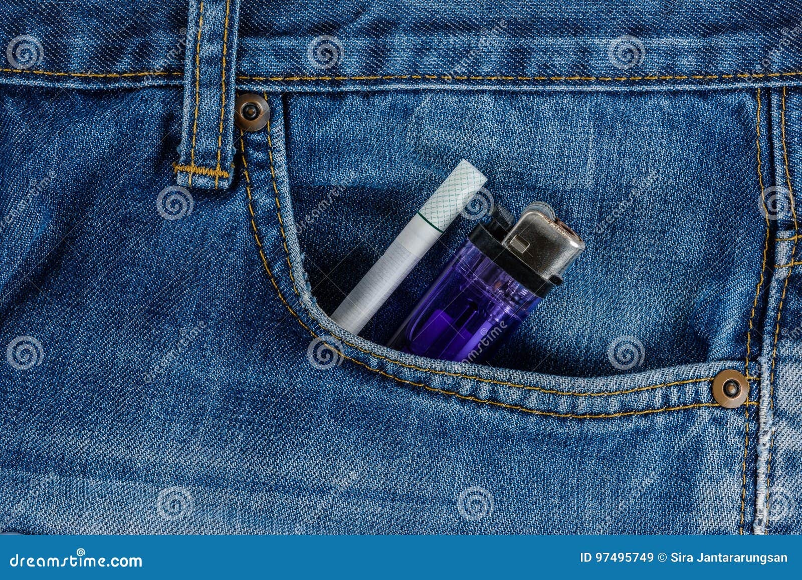 Cigarettes and Cheap Lighter in Old Blue Denim Jeans Pocket Stock Image