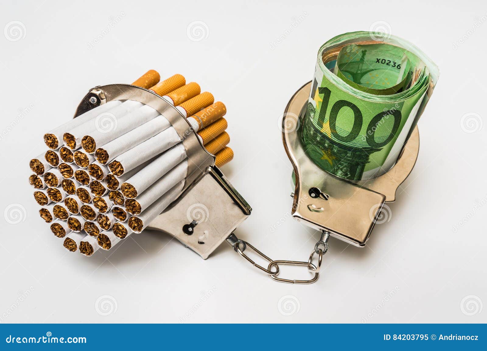 Cigarettes and Money with Handcuffs Cost of Smoking Stock Image
