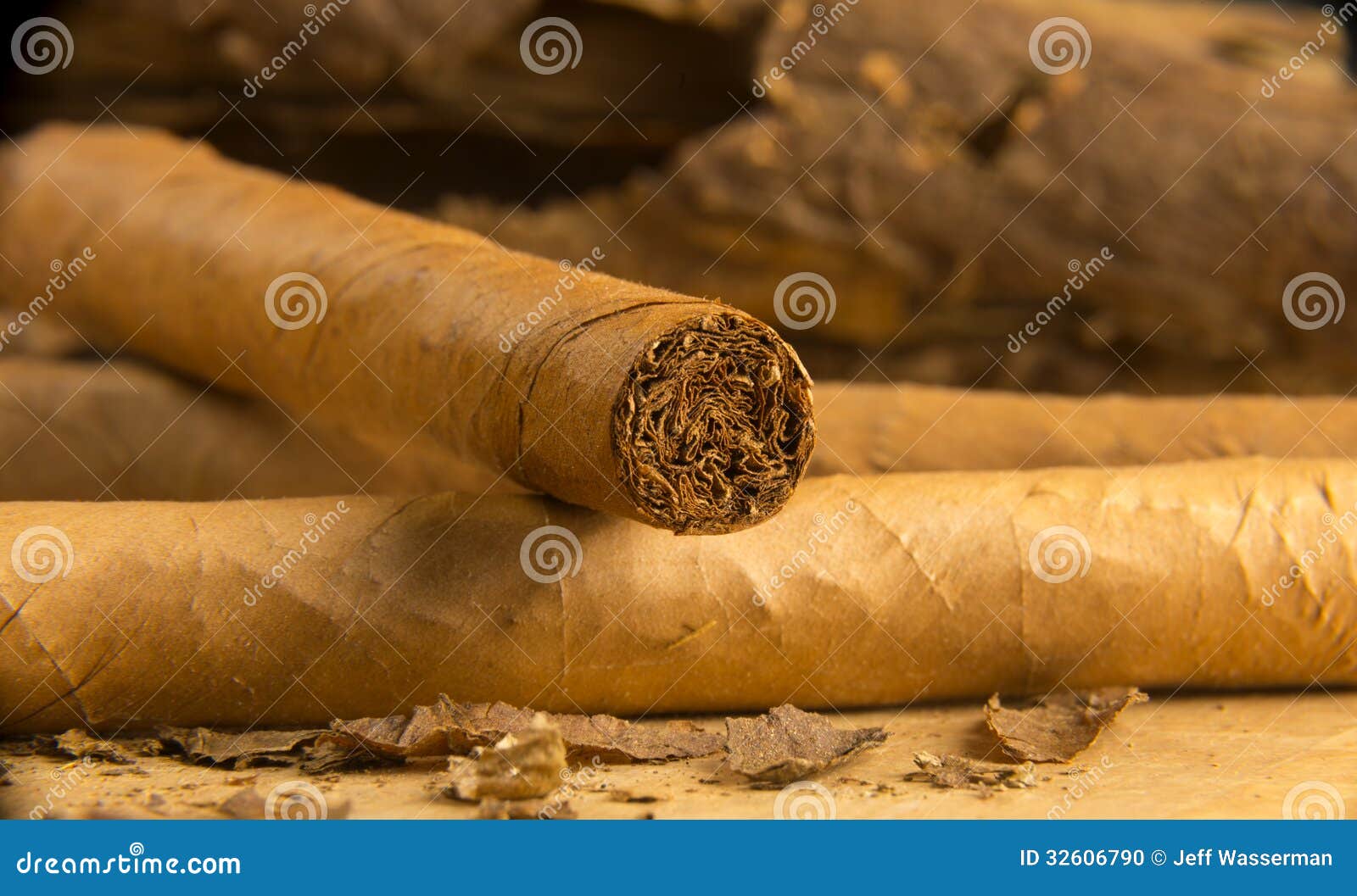 Cigars All Rolled Up With Loose Tobacco Leaves Stock Photo - Image