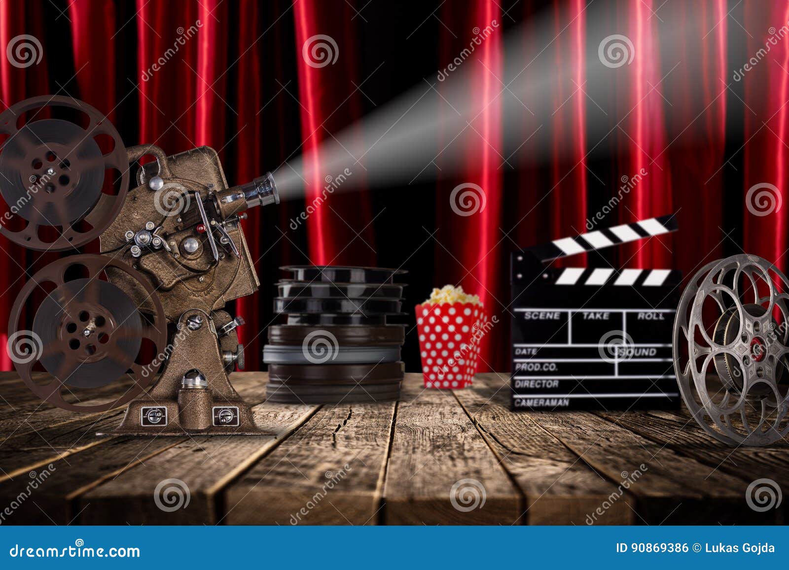 Cinema concept of vintage film reels, clapperboard and projector