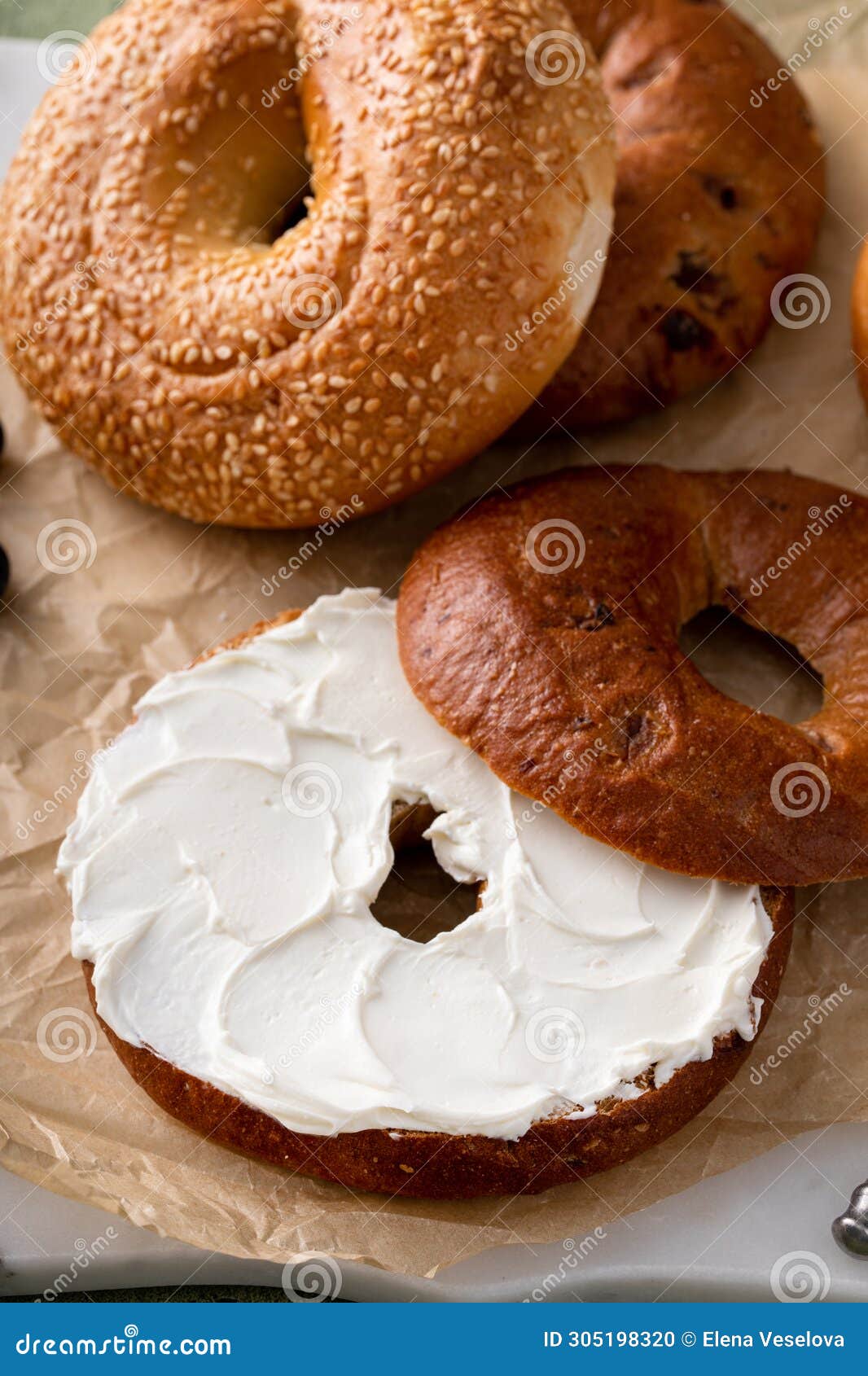 Cinnamon Raisin Bagel Topped with Cream Cheese Stock Photo - Image of